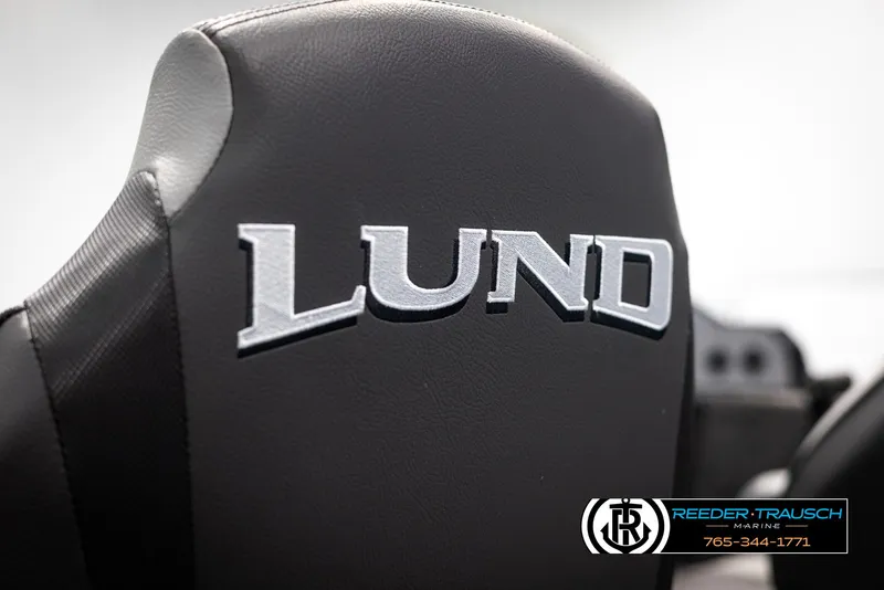 Slide: The Image of 2025 Lund Rebel XL SS boat seat with logo, Reeder-Trausch Marine branding. - 28