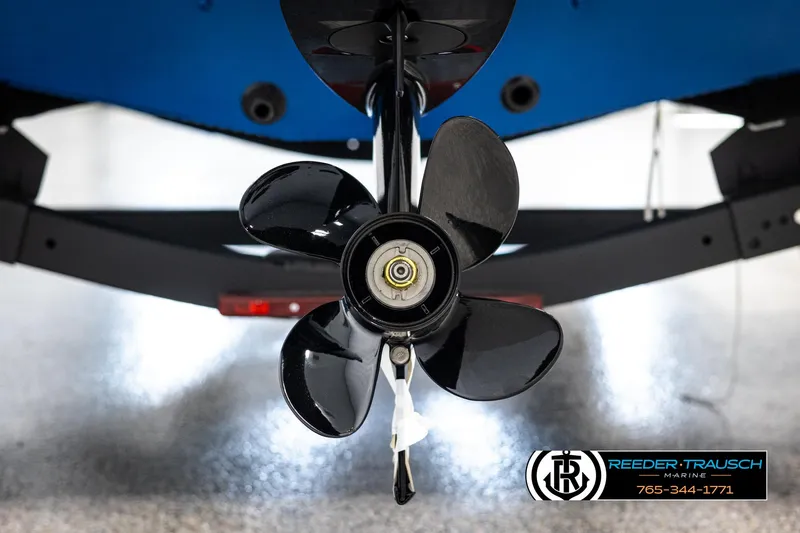 Slide: The Image of 2025 Lund Rebel XL SS boat propeller close-up in a showroom. - 34