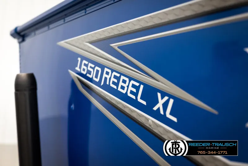 Slide: The Image of 2025 Lund Rebel XL SS boat with "1650 Rebel XL" decal, blue exterior. - 36