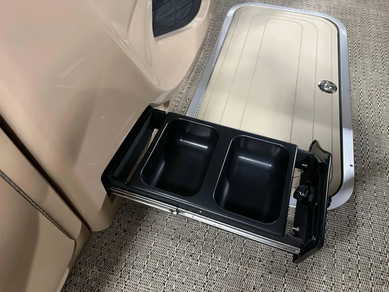 Slide: The Image of 2025 Barletta Lusso 23UC pontoon boat with dual cup holders and storage compartment. - 11