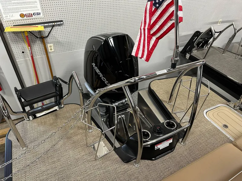 Slide: The Image of 2025 Barletta Lusso 23UC boat interior with Mercury engine and American flag. - 20