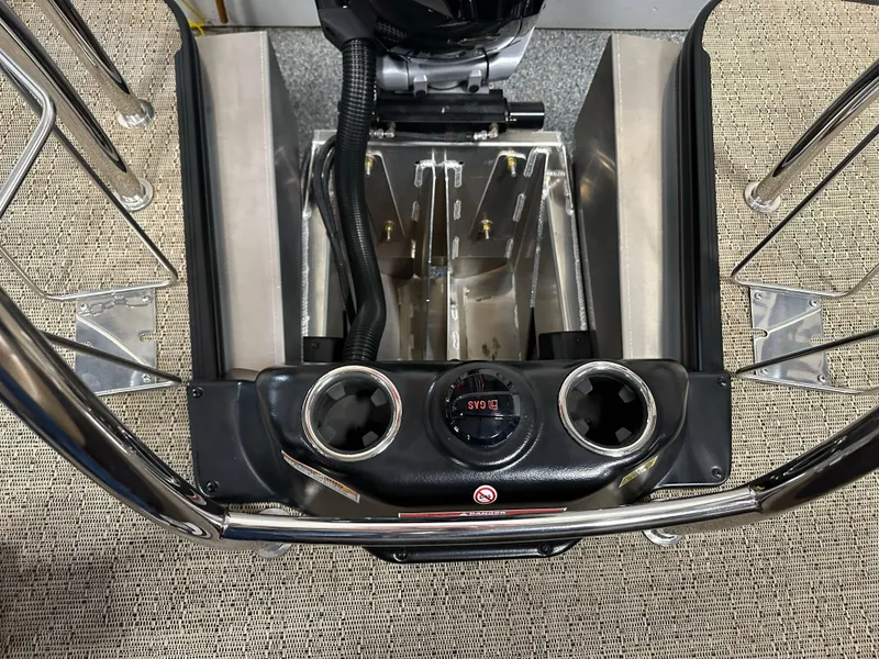 Slide: The Image of 2025 Barletta Lusso 23UC boat engine compartment with control panel and cup holders. - 21