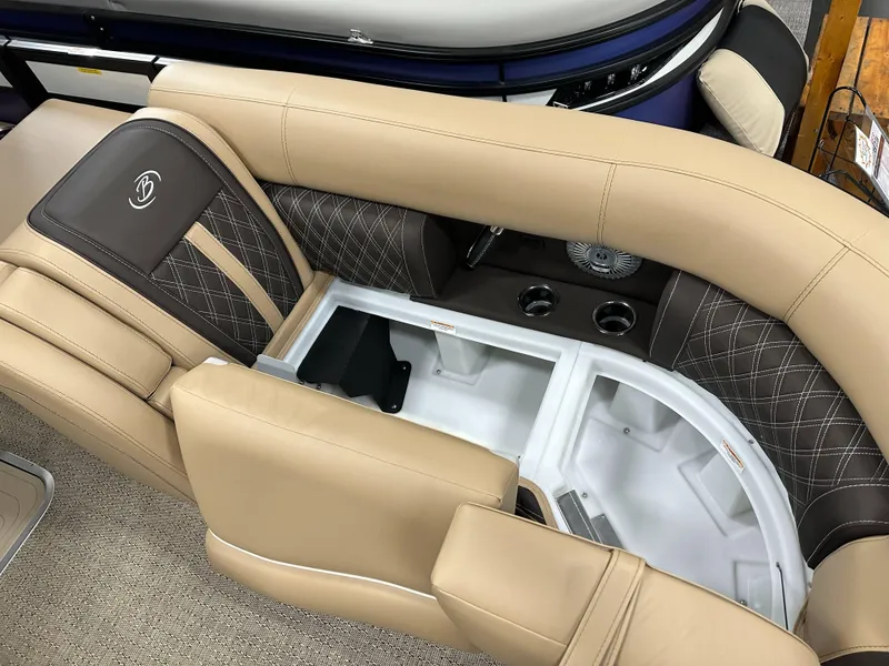 Slide: The Image of Luxurious seating on 2025 Barletta Lusso 23UC boat, featuring beige and brown upholstery with storage. - 8
