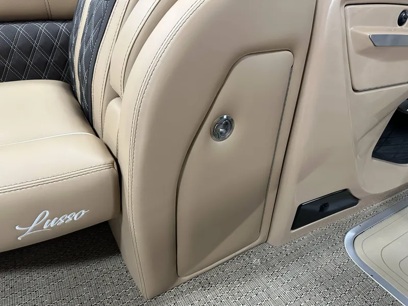 Slide: The Image of 2025 Barletta Lusso 23UC interior, featuring luxurious beige and black seating with elegant stitching. - 9