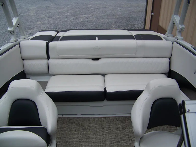Slide: The Image of 2019 Crownline 215SS boat interior with white and black seating. - 5