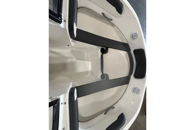 Slide: The Image of 2021 Bayliner VR6 Bowrider OB on calm water, featuring a spacious interior and canopy. - 12