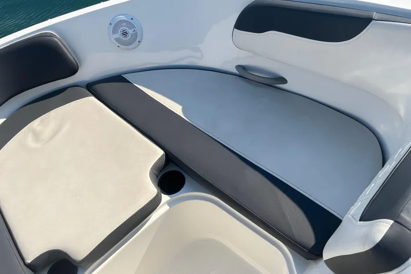 Slide: The Image of 2021 Bayliner VR6 Bowrider OB interior with seating, on calm water. - 14