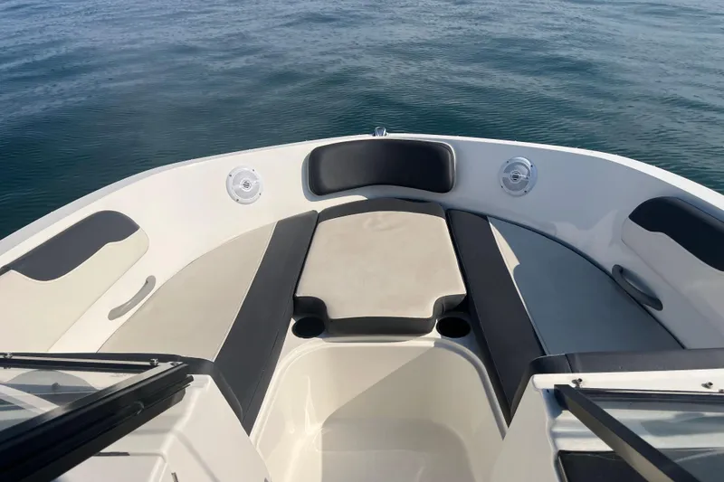 Slide: The Image of 2021 Bayliner VR6 Bowrider OB interior with white and black seating arrangement. - 16