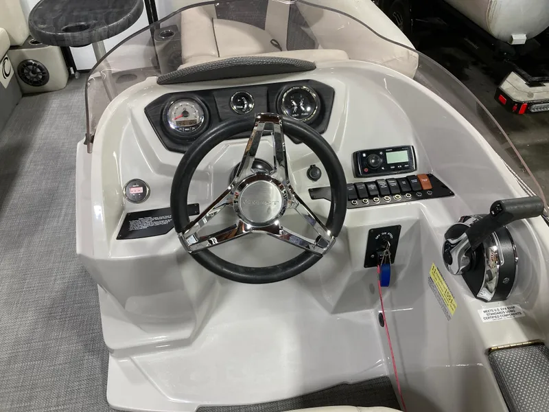 Slide: The Image of 2021 Bayliner VR6 Bowrider OB interior seat with black and white upholstery. - 6