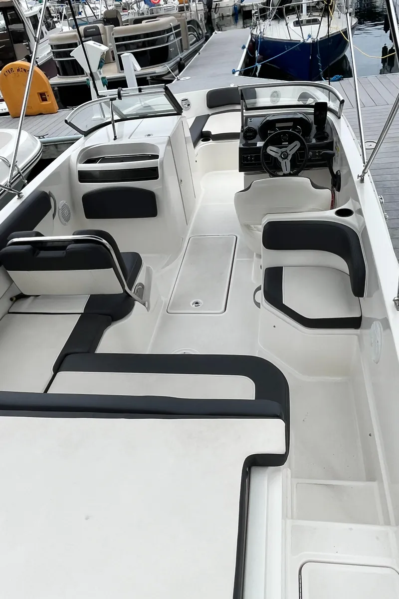 Slide: The Image of 2021 Bayliner VR6 Bowrider OB interior cabin with small window. - 7
