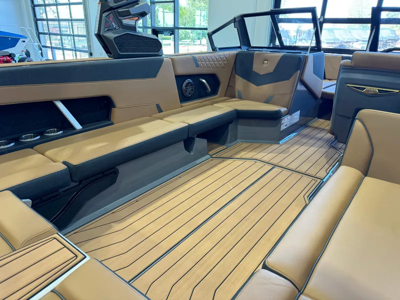 Slide: The Image of 2025 Nautique Super Air Nautique GS24 interior with luxurious seating and modern design. - 14