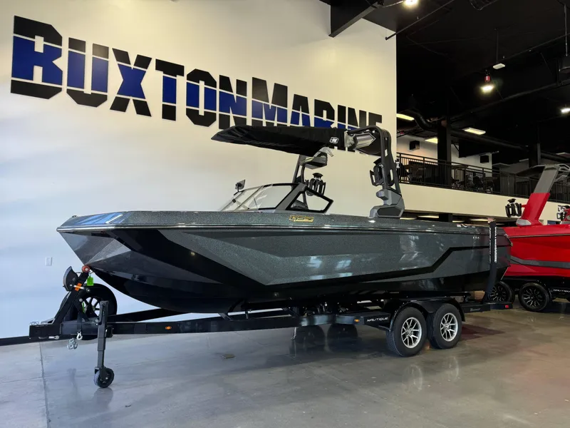 Slide: The Image of 2025 Nautique Super Air Nautique GS24 boat displayed at Buxton Marine showroom. - 3