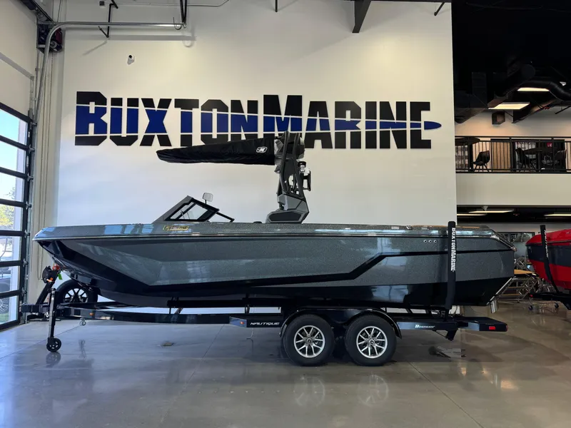 Slide: The Image of 2025 Nautique Super Air Nautique GS24 boat displayed at Buxton Marine showroom. - 4