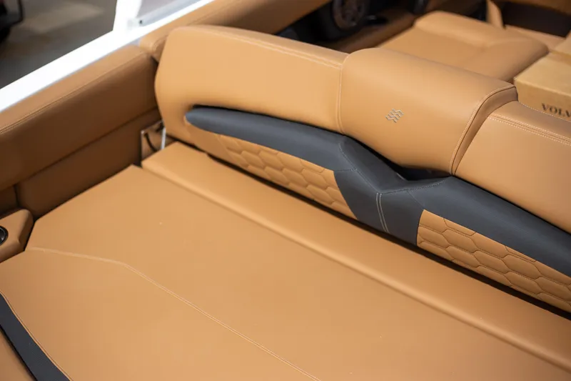 Slide: The Image of Luxurious tan leather seating in 2025 Four Winns HD5 boat interior. - 7