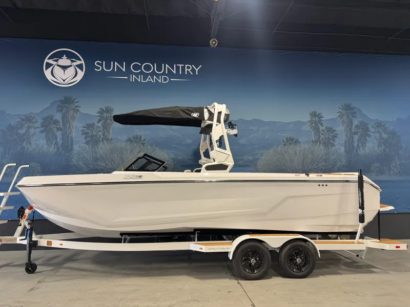 The Image of 2025 Nautique Super Air Nautique GS24 boat on trailer at Sun Country Inland showroom. - 1