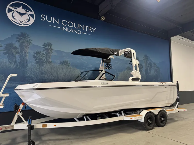 Slide: The Image of 2025 Nautique Super Air Nautique GS24 boat on trailer at Sun Country Inland showroom. - 2