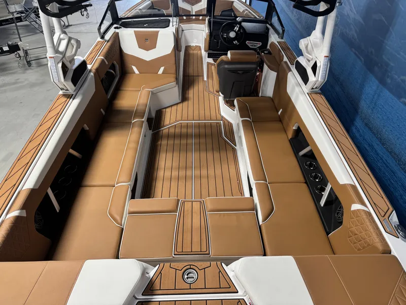 Slide: The Image of 2025 Nautique Super Air Nautique GS24 interior with tan and white seating, sleek design. - 5