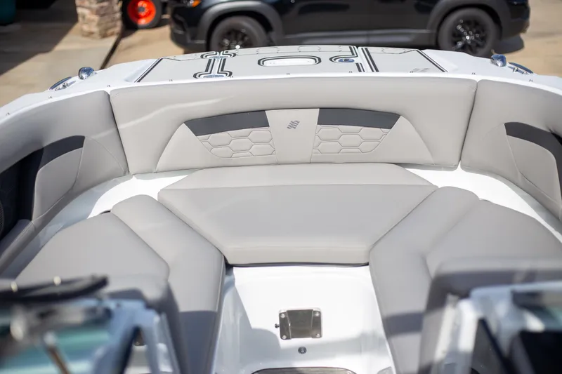 Slide: The Image of 2025 Four Winns HD3 boat interior with gray seating and modern design. - 11