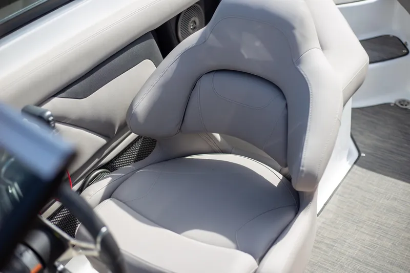 Slide: The Image of 2025 Four Winns HD3 boat interior with plush gray seating. - 12