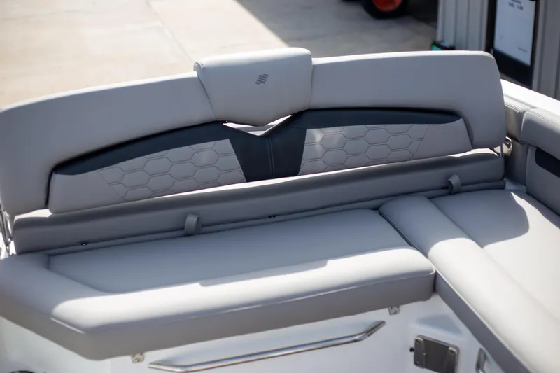 Slide: The Image of 2025 Four Winns HD3 boat interior seating with modern design and hexagonal pattern. - 9
