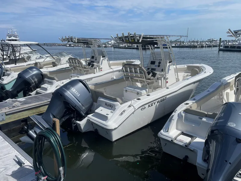 Slide: The Image of 2023 Key West 239 FS boats docked with Yamaha engines. - 1