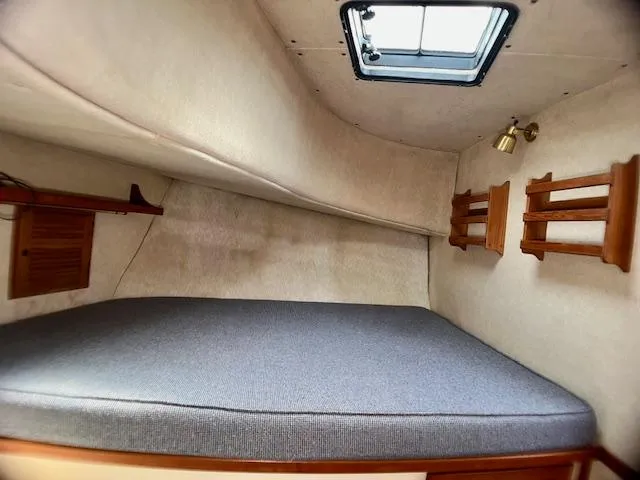 Slide: The Image of Cozy cabin interior of 1989 Nordic Tug 32 with bed and porthole. - 21
