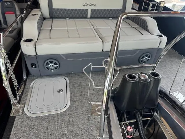 Slide: The Image of 2025 Barletta Lusso 23UC boat interior with plush seating and modern amenities. - 12