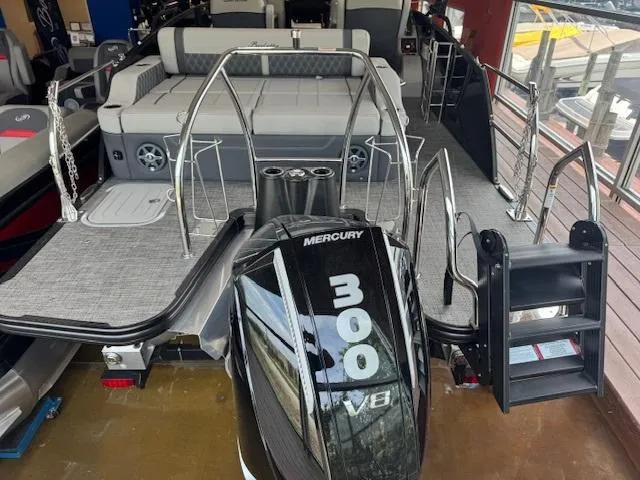 Slide: The Image of 2025 Barletta Lusso 23UC pontoon boat with Mercury 300 V8 engine, docked and ready. - 2