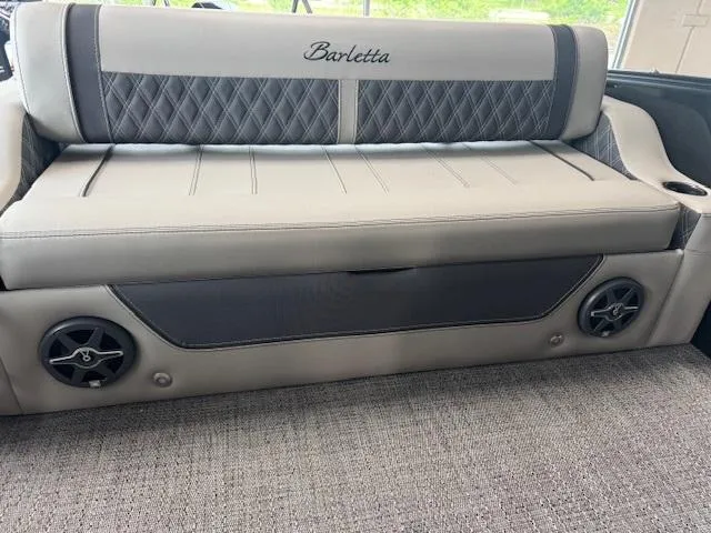 Slide: The Image of 2025 Barletta Lusso 23UC boat seat with elegant stitching and integrated speakers. - 8