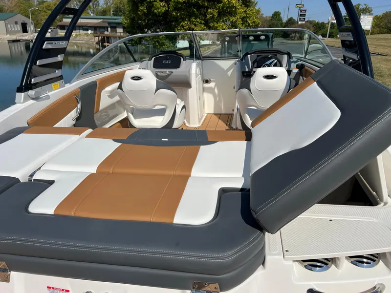Slide: The Image of 2025 Chaparral 21 SSi boat interior with stylish seating and modern dashboard. - 11