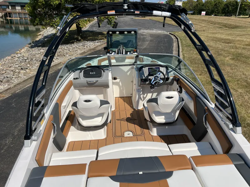 Slide: The Image of 2025 Chaparral 21 SSi boat interior with modern seating and sleek design. - 12