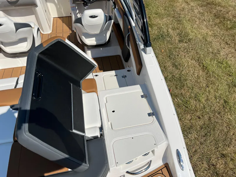 Slide: The Image of 2025 Chaparral 21 SSi boat interior with seating and storage compartments. - 13