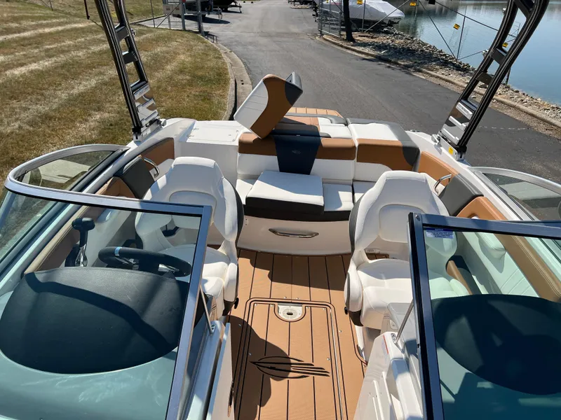 Slide: The Image of 2025 Chaparral 21 SSi boat interior with plush seating and modern design. - 22