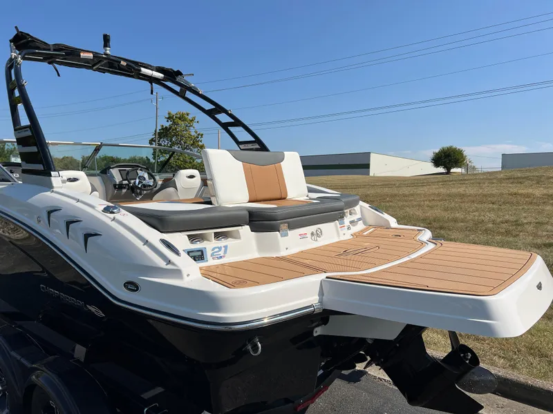 Slide: The Image of 2025 Chaparral 21 SSi boat with sleek design and spacious deck. - 6