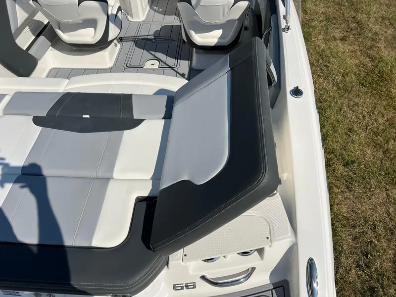Slide: The Image of 2025 Chaparral 21 SSi boat interior with white and black seating. - 10