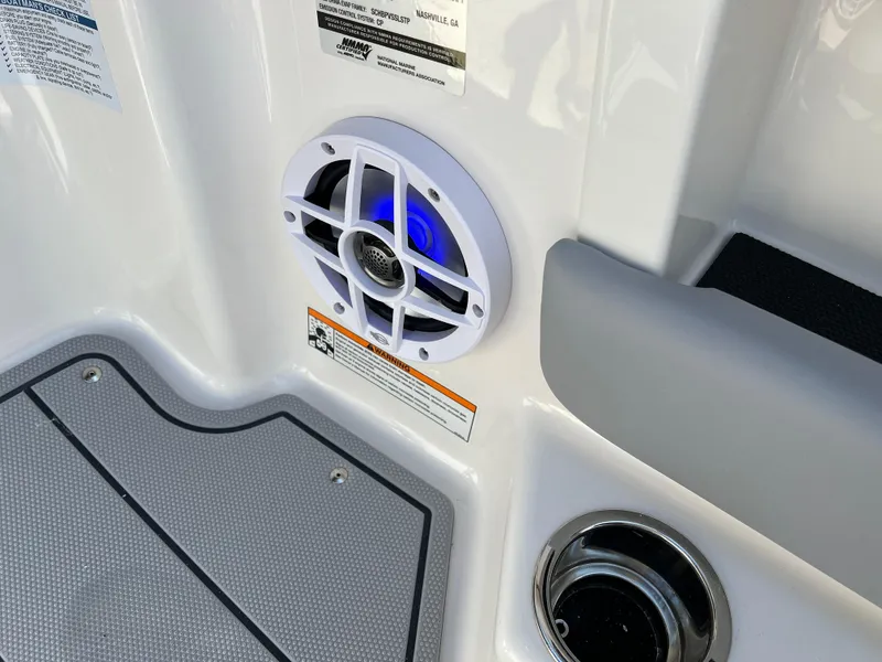 Slide: The Image of 2025 Chaparral 21 SSi boat interior with speaker and cup holder. - 14