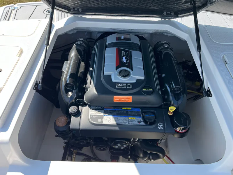 Slide: The Image of 2025 Chaparral 21 SSi boat engine compartment with 250 horsepower engine. - 21
