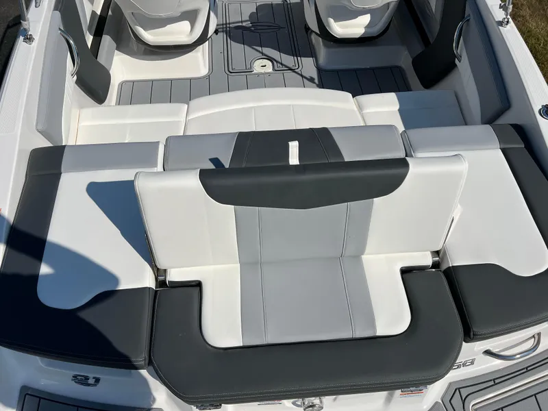 Slide: The Image of 2025 Chaparral 21 SSi boat interior with sleek, modern seating design. - 8