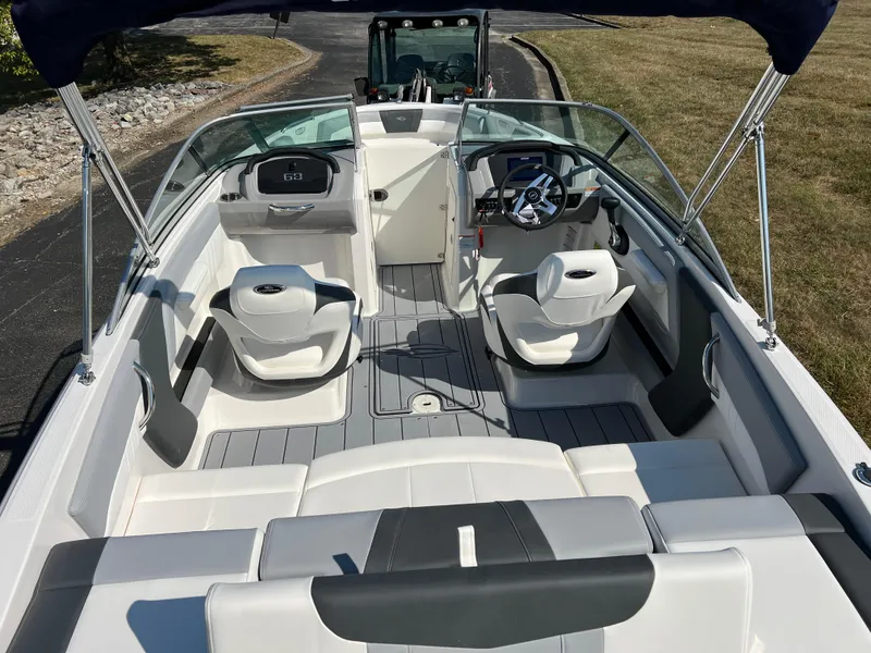 Slide: The Image of 2025 Chaparral 21 SSi boat interior with modern seating and steering console. - 9