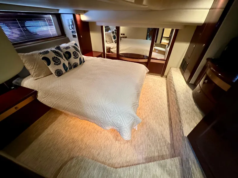 Slide: The Image of Luxurious interior of 2008 Sea Ray 58 Sedan Bridge with elegant seating and wooden table. - 10