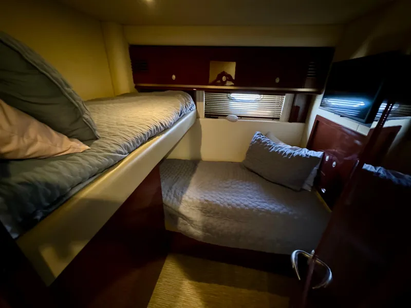 Slide: The Image of Luxurious bedroom interior of 2008 Sea Ray 58 Sedan Bridge yacht with elegant wood finishes. - 13