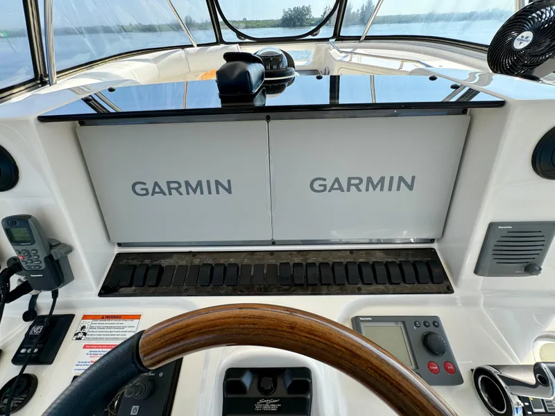 Slide: The Image of Helm of 2008 Sea Ray 58 Sedan Bridge with dual Garmin displays. - 19