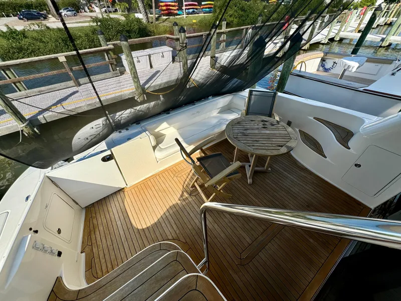 Slide: The Image of 2008 Sea Ray 58 Sedan Bridge yacht docked at marina, rear view. - 5