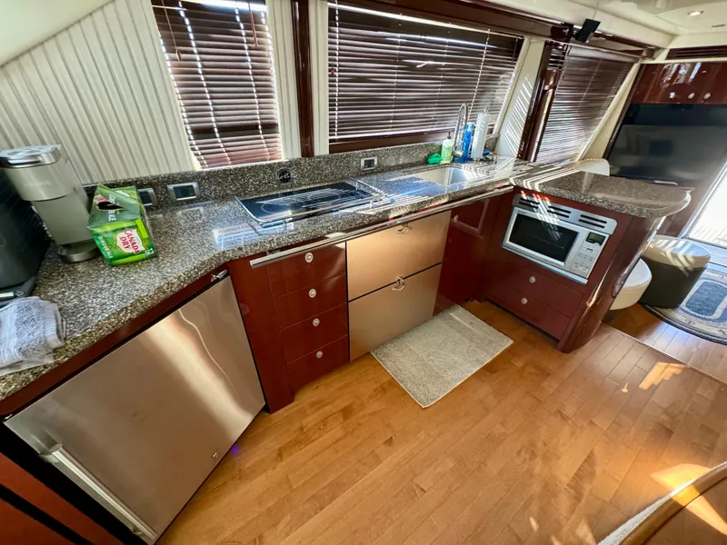 Slide: The Image of Luxurious interior of 2008 Sea Ray 58 Sedan Bridge yacht with elegant seating and nautical decor. - 9