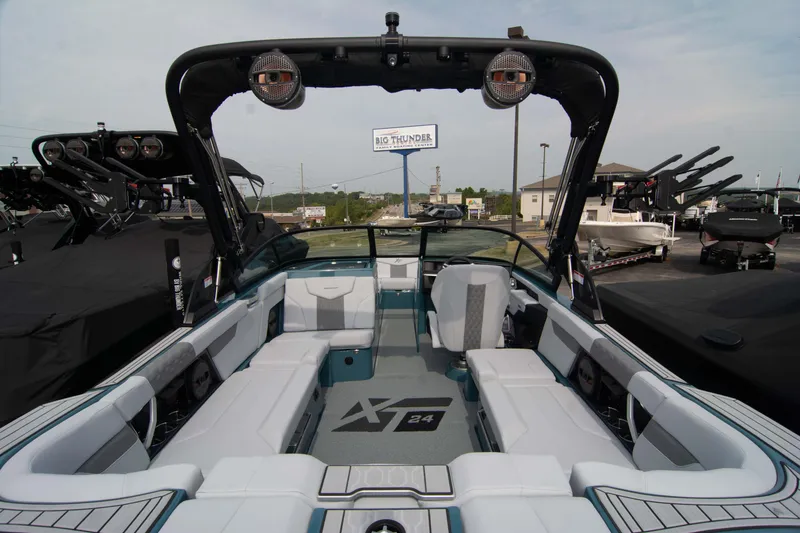 Slide: The Image of 2025 MasterCraft XT24 boat interior with spacious seating and modern design. - 30