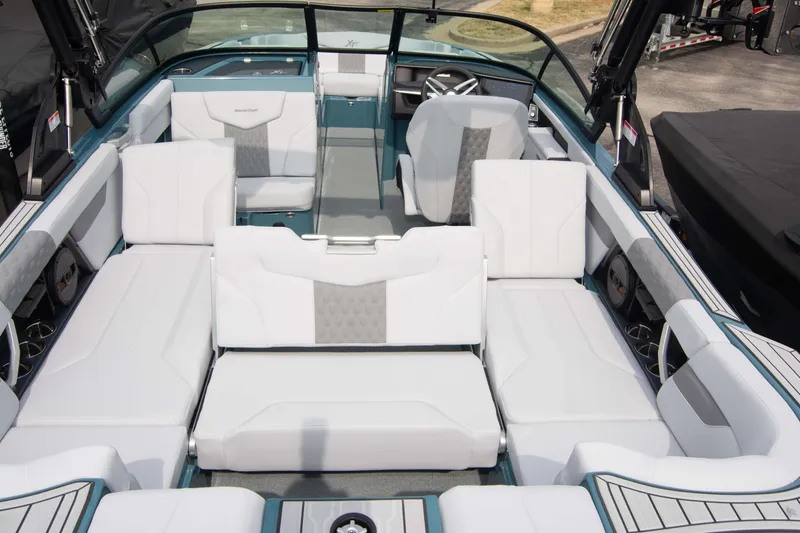 Slide: The Image of 2025 MasterCraft XT24 boat interior with spacious white seating and modern design. - 32