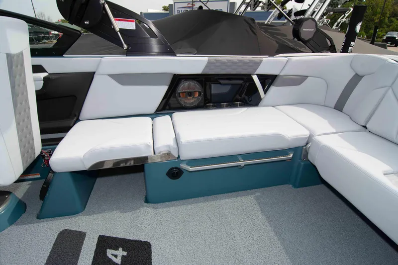 Slide: The Image of 2025 MasterCraft XT24 boat interior with white seating and modern design. - 33
