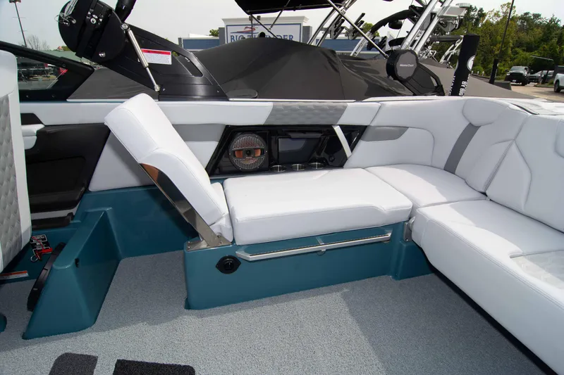 Slide: The Image of 2025 MasterCraft XT24 boat interior with white seating and modern design. - 34