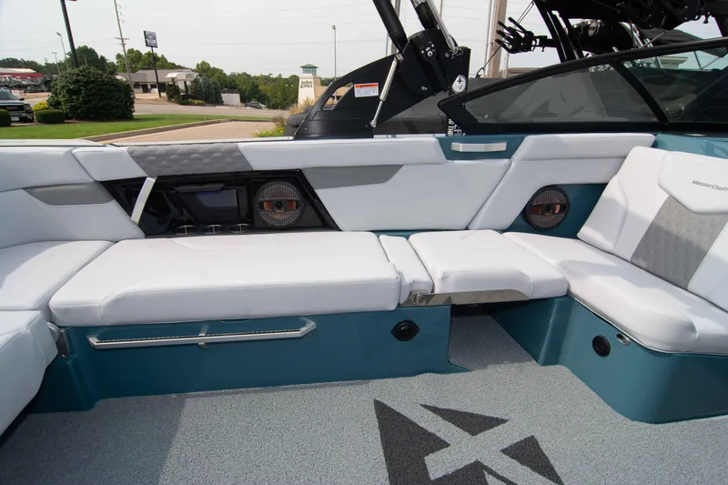 Slide: The Image of 2025 MasterCraft XT24 boat interior with white seating and modern design elements. - 35