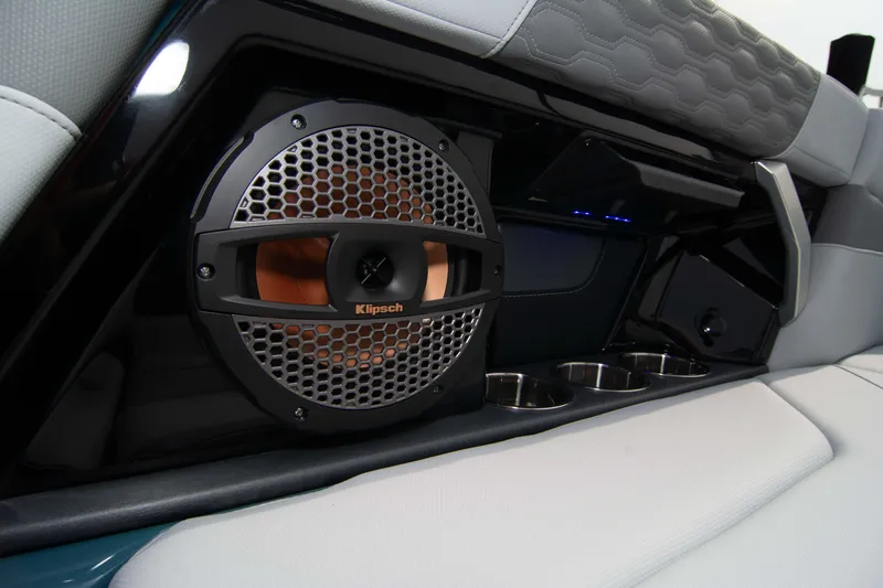 Slide: The Image of 2025 MasterCraft XT24 interior with Klipsch speaker and cup holders. - 41